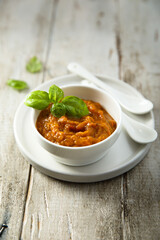 Homemade roasted vegetables dip with fresh basil