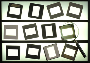 light table  with empty photographic slides and  magnifying glass,blank picture frames. analog...