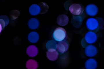 Blue abstract bokeh lights with black background