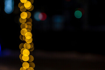 Golden and blue Christmas lights background with bokeh. Defocused
