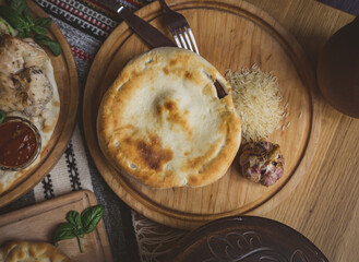 The concept of oriental cuisine. Homemade georgian Uzbek pilaf or plov from lamb served in cast iron cookware. Copy space.