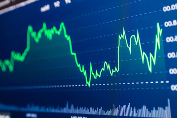 Stock market success chart on the screen. Selective focus.