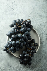 Dark grape on a white plate