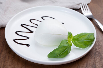 Tasing of fresh italian cheese mozzarella di buffalo with Balsamic vinegar from Modena