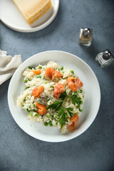 Homemade risotto with salmon and green pea