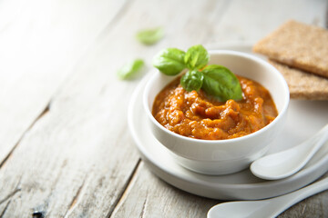 Homemade roasted vegetables dip with fresh basil