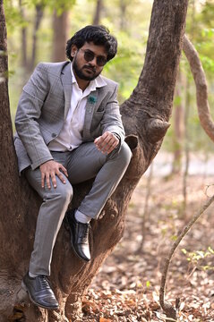 man sitting on a tree