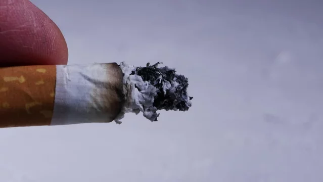 flick cigarette Smoker flicking cigarette ash