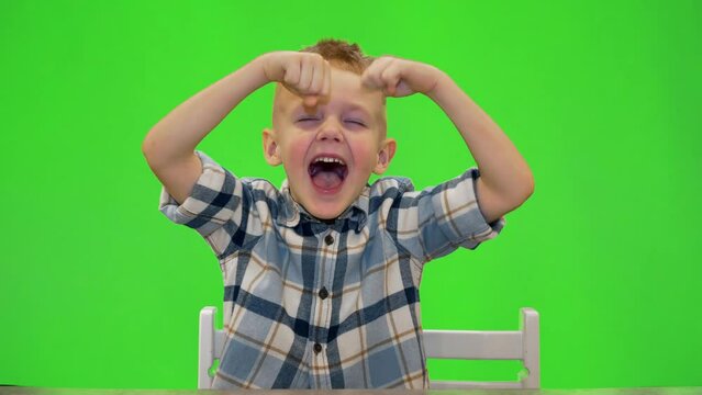 5 year old boy laughing and playing around, chromakey