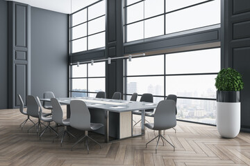 Front view on stylish spacious meeting room with big conference table surrounded by modern chairs on parquet floor, grey wall and skyscrapers view from the window. 3D rendering