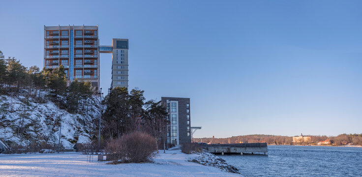 Panorama view, tower apartments buildings in the island Kvarnholmen at the bay Saltsj&ouml;n a sunny winter day in Stockholm