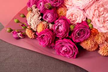 Beautiful bouquet with purple roses close up