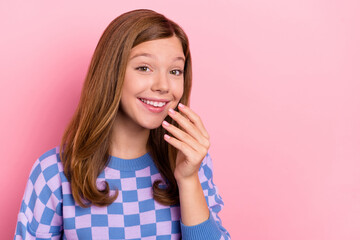 Photo of brown hairdo funky small girl hand face wear blue sweater isolated on pink color background