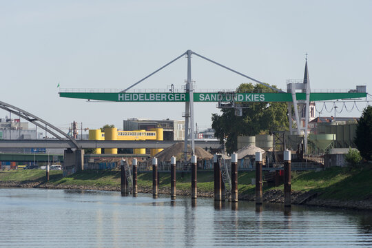 Mannheim, Germany – Sept. 13, 2020: HeidelbergCement Group at „Rhine-Neckar harbor“, one of the biggest european inner harbors, known for sustainability and environment protection. View to cargo load.