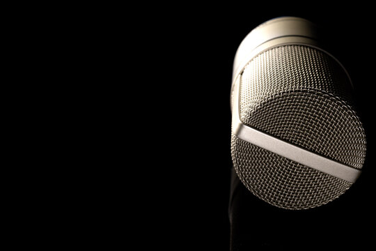 Condenser Gold Studio Microphone On A Black Background.