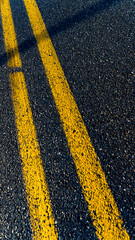 Fototapeta premium Yellow middle lines on the road