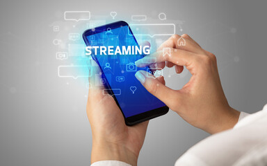 Hand using smartphone with social media concept