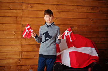 Boy with Denmark flags. Travel to Scandinavian countries. Happiest danish people's .