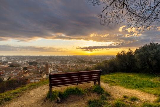 Bench and Pietrasanta panoramic view at sunset, Versilia, Lucca, Tuscany, Italy