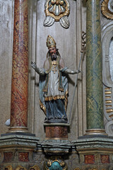Fototapeta na wymiar St. Blaise, statue on the altar of St. Anthony of Padua in the Franciscan Church of St. Peter in Cernik, Croatia
