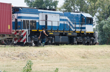 Naklejka premium freight train, transport of fuel or grains transporting cargo for the agricultural industry in the Argentine countryside