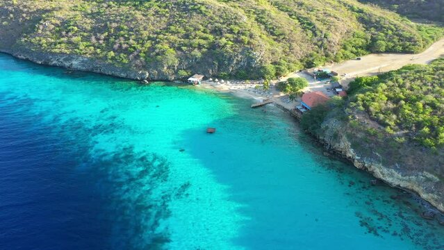 Aerial view of the coast of Cura&ccedil;ao in the Caribbean Sea with turquoise water, cliff, beach, and beautiful coral reef around Vaersenbay