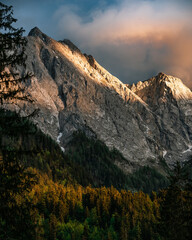 Germany's highest mountain, Zugspitze and its ridge colored red by the last rays of sunset. Sunset at Zugspitze, Germany, Europe.