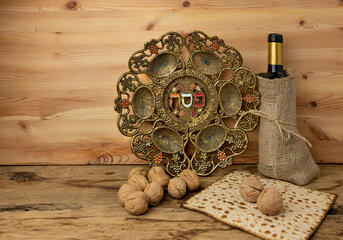 Matzo and vintage Passover plate for Jewish Pesach holidays.  English translation from Hebrew : Passover ( plate center).