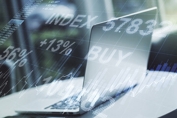 Double exposure of abstract creative financial diagram on modern laptop background, banking and accounting concept