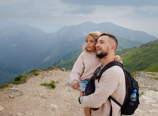 Happy family vacation. Father and child daughter on adventure travel. Family hiking on the top...