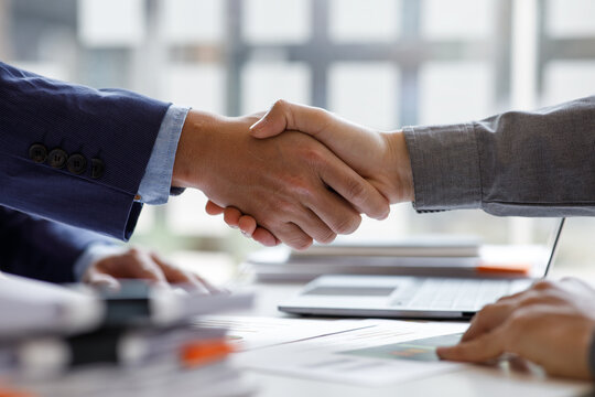 Financial Business handshake for teamwork of business merger and acquisition, successful negotiate, hand shake, two businessman shake hand with partner to celebration partnership business deal concept