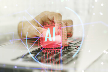 Double exposure of creative artificial Intelligence abbreviation with hand typing on computer...