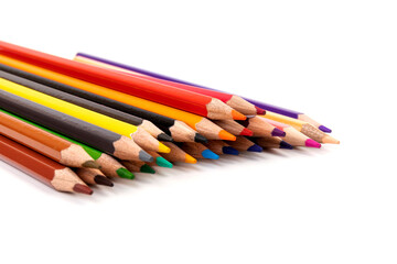 Many multicolored pencils, isolated on white background with copy space. Art and education background.