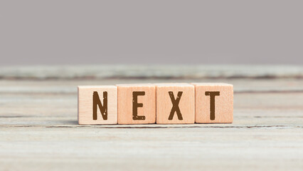 Word Next on wood cubes