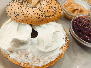 Close-up of bagel with cream cheese. Healthy breakfast