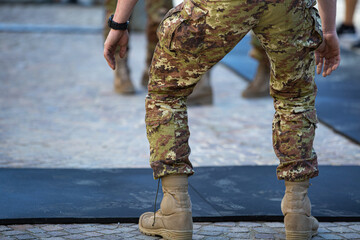 Detail of a Soldier's Legs: Getting Ready to do Exercises with Camouflage Pants