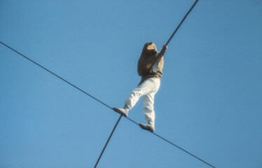 Chord dancer. Balancing on a wire. Circus.