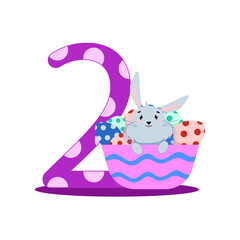 number two with a gray bunny sitting in a basket with eggs