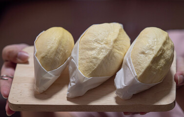 Yellow durian is appetizing in a white dish. The fruit king of Thailand