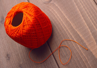 Nylon knitting threads on a wooden background