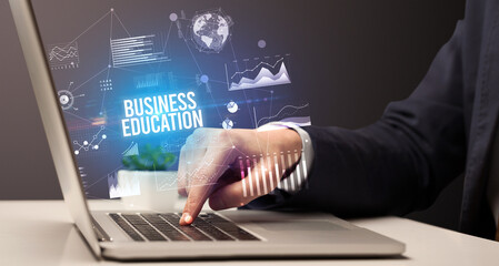 Businessman working on laptop, business concept