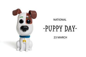 Cute toy small dog and text National puppy day 23 march isolated on white background Greeting card