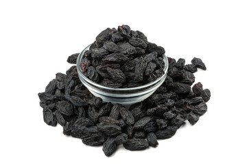 Black royal raisins in a plate on a white background isolate