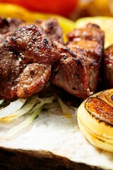 Appetizing grilled meat. Assorted vegetables. Close-up. Vertical shot. Copy space