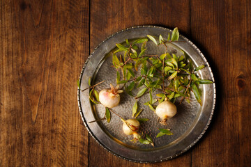 pomegranate fruits from a pomegranate tree on a metal plate