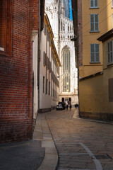 Fototapeta premium main cathedral is visible in the gap between the buildings