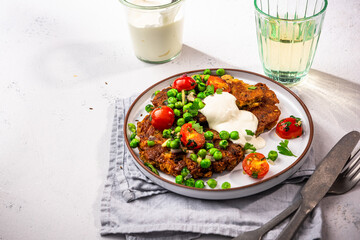 Chickpea pancakes with green peas. Vegetarian superfood, healthy brunch idea