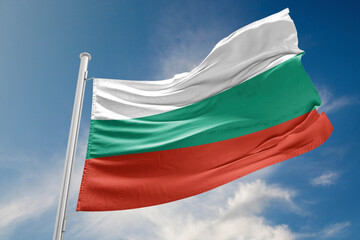 Naklejka na ściany i meble Bulgarian Flag is Waving Against Blue Sky