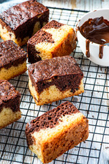Chocolate marble cake. Slices on tray and wooden table