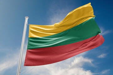 Lithuania Flag is Waving Against Blue Sky - obrazy, fototapety, plakaty